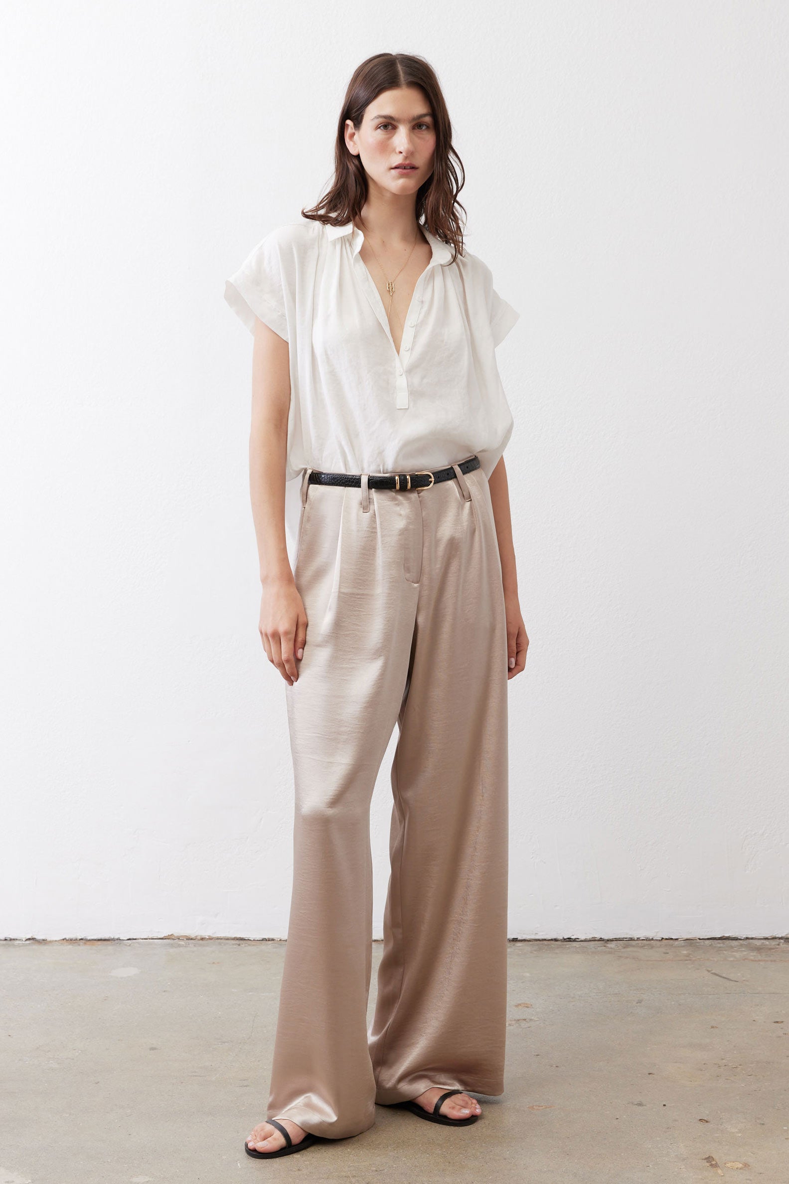 Champagne wide-leg trousers with elastic waistband and black belt detail