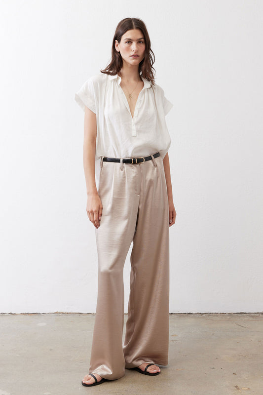 Champagne wide-leg trousers with elastic waistband, belt loops, and side pockets.