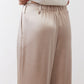Champagne wide-leg trousers with front pocket and loose drape from elastic waist