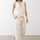 Ivory linen wide-leg trousers, side-facing front view with tied waist