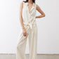 Ivory linen wide-leg trousers, front view with tied waist and long drape