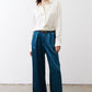 Deep teal wide-leg trousers with pleats, belt loops, and straight drape