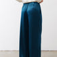 Deep teal wide-leg trousers with belt loops and relaxed straight legs