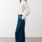 Deep teal wide-leg trousers with pleats, belt loops, and side pockets