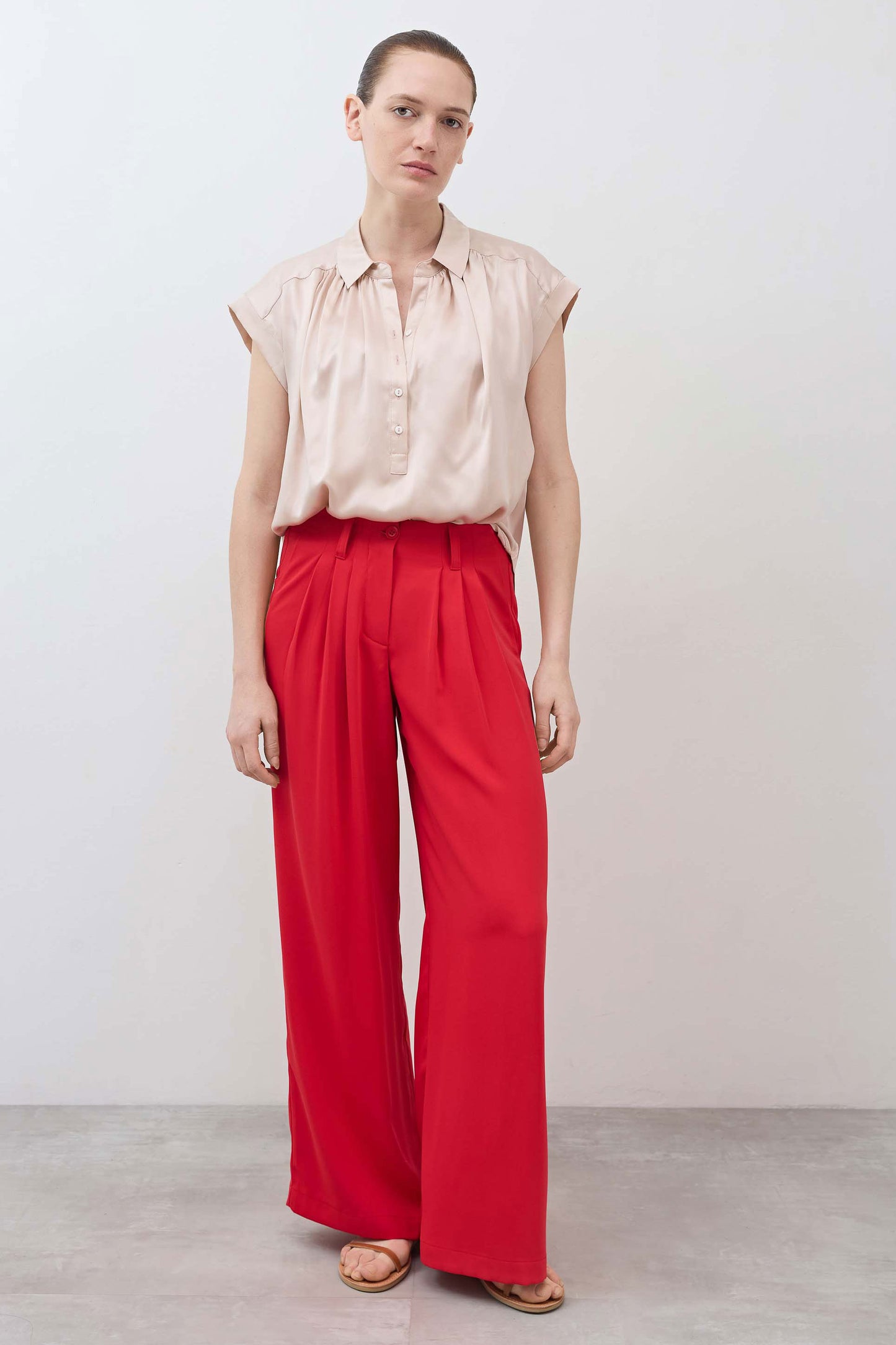 Blush oversized silk blouse with button-front and short sleeves