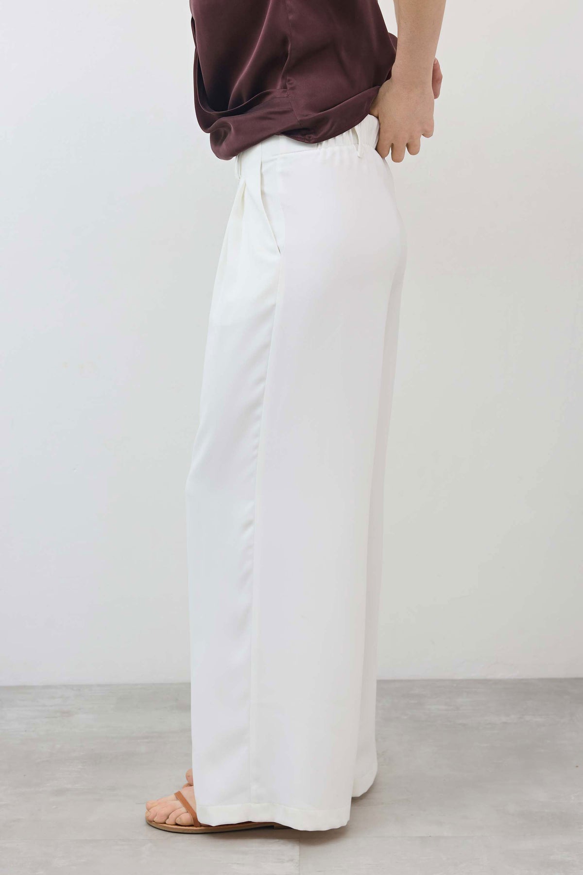White wide-leg trousers with stitched seams and relaxed straight leg