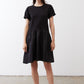 Black short-sleeve crewneck dress with gathered skirt tiers, above-knee length