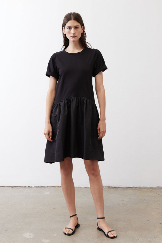 Black short-sleeve crewneck dress with gathered skirt tiers, above-knee length