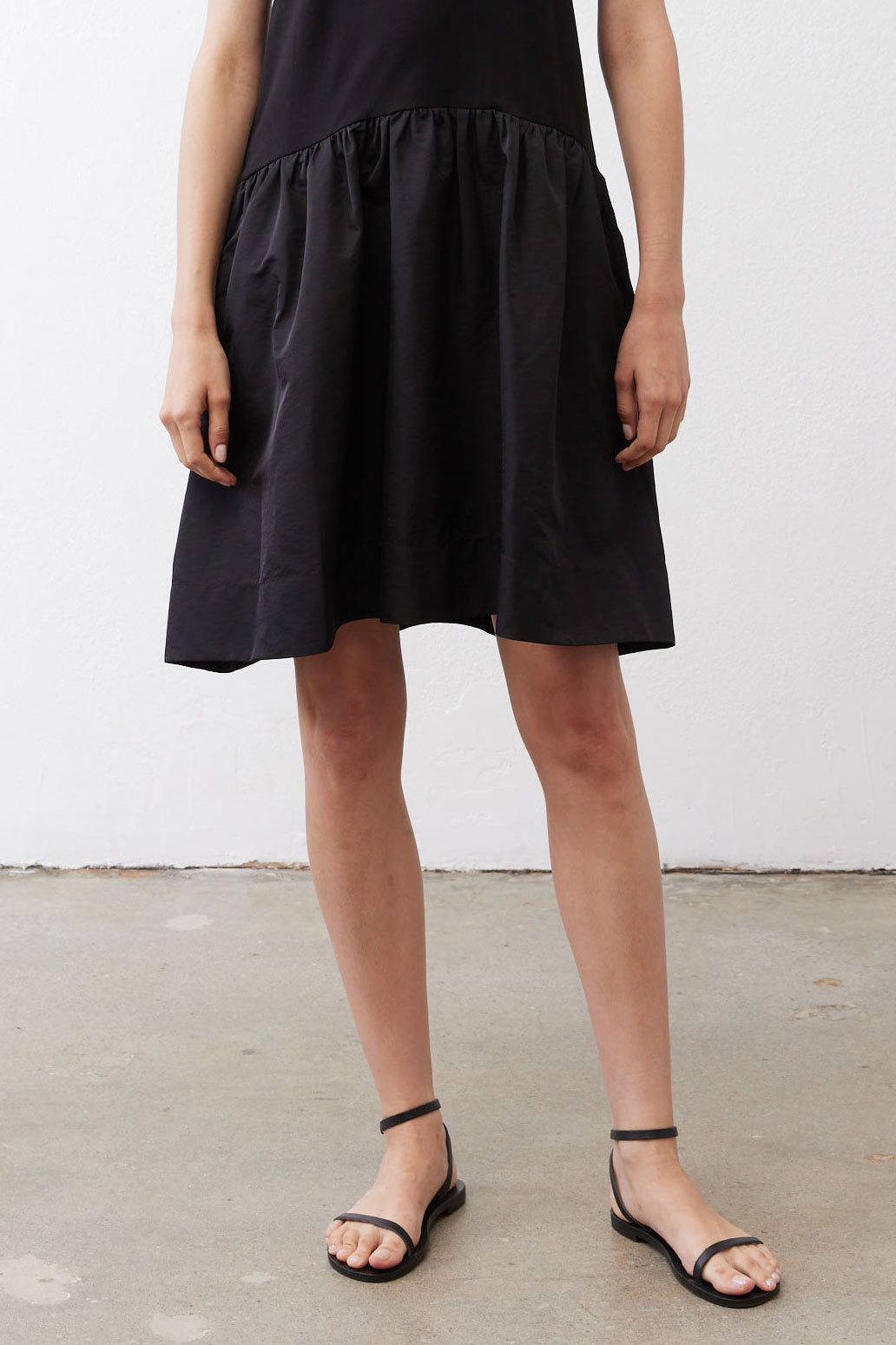 Black midi dress with gathered skirt and sleeveless bodice
