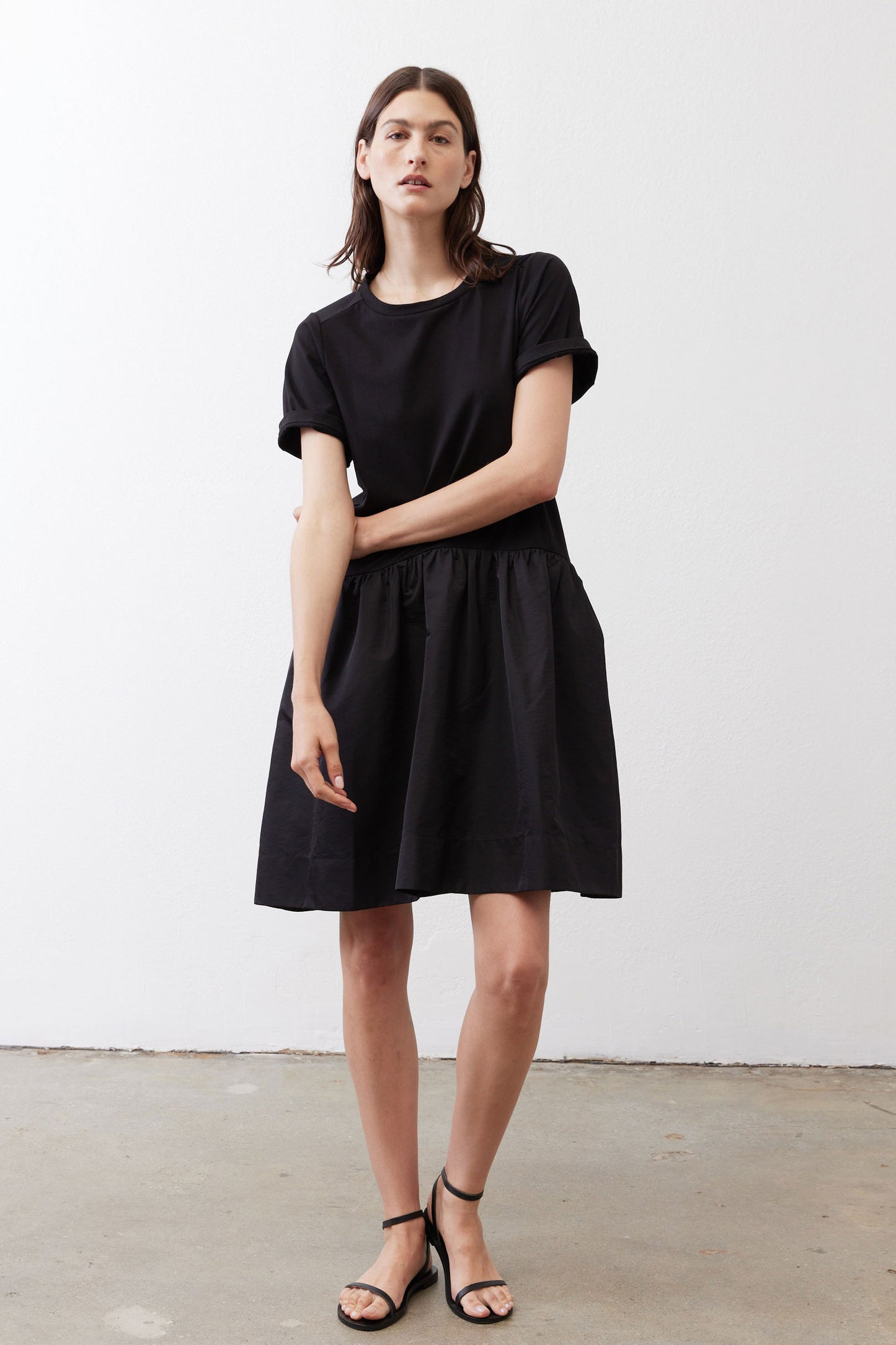 Black crewneck short-sleeve dress with gathered waist and skirt, above-knee