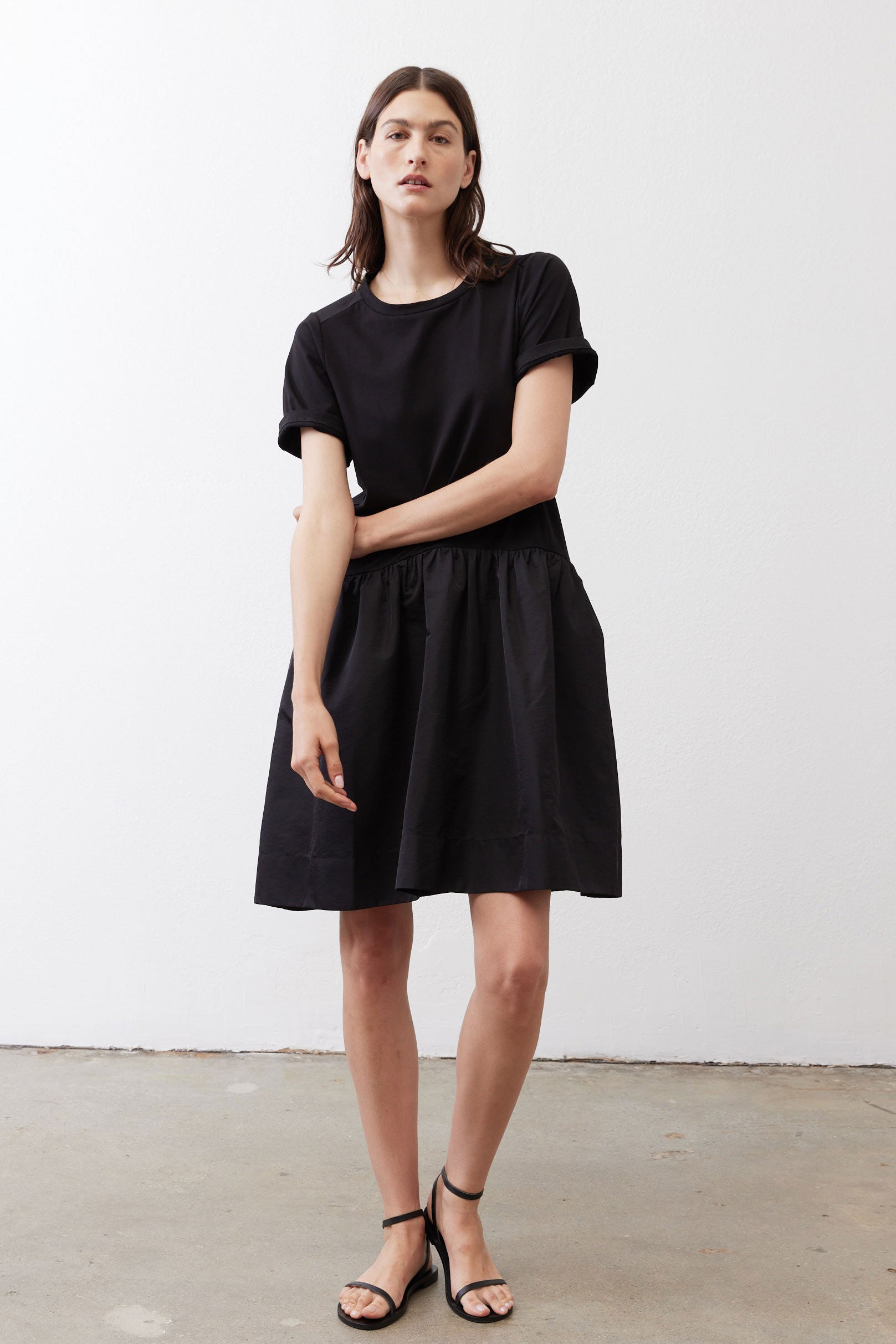 Black crewneck short-sleeve dress with gathered waist and skirt, above-knee