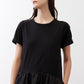 Black short-sleeve crewneck dress with gathered waist detail, close-up